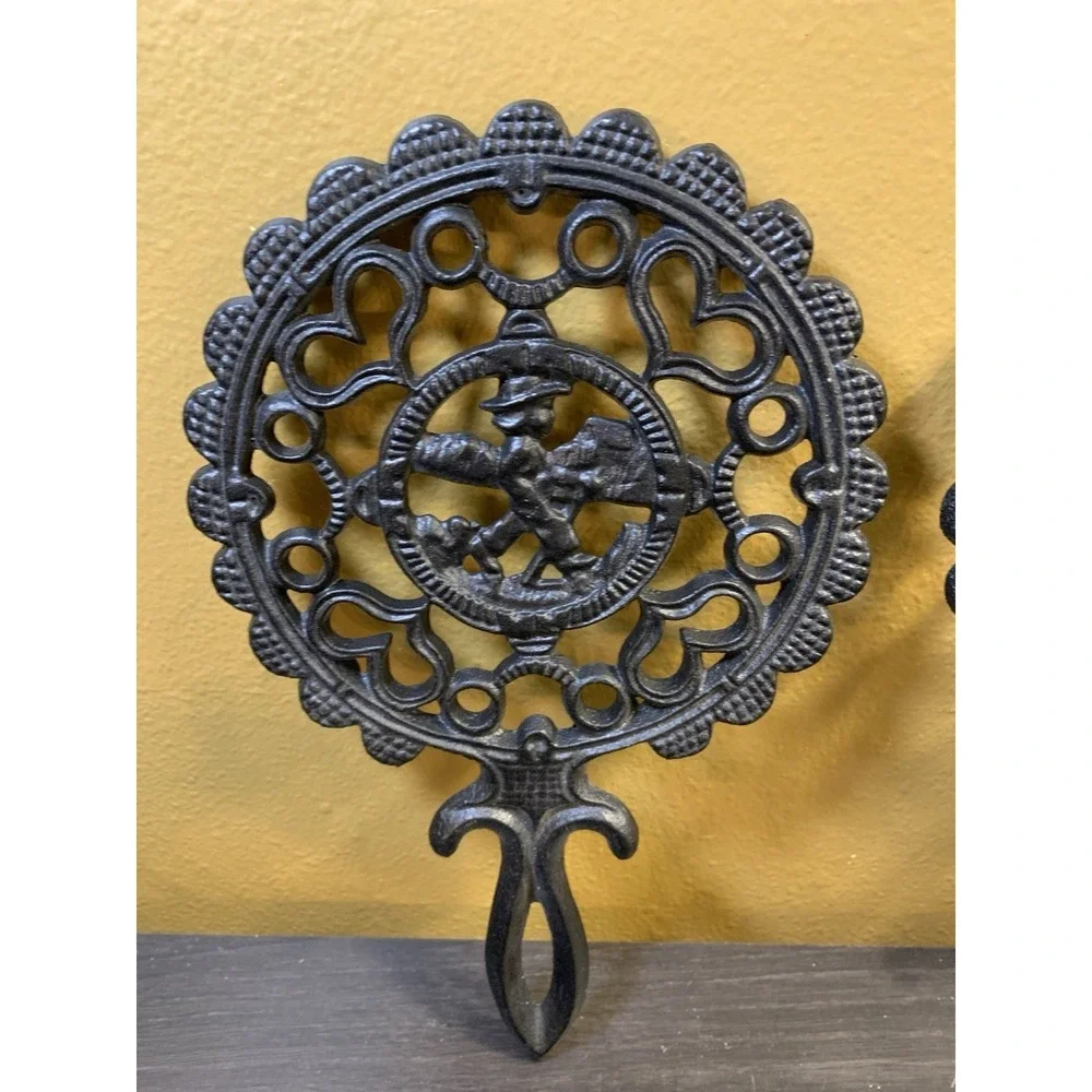 Two Fancy Vintage Cast Iron Trivets Black J.Z.H Amish Boy Girl 1952